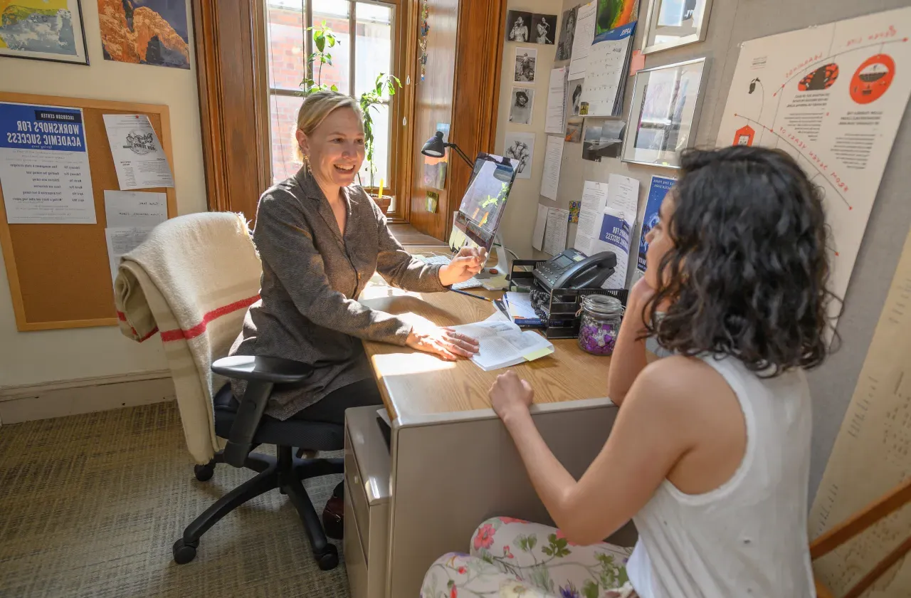 Student and professor talking.